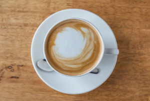 Coffee in white cup on wood table